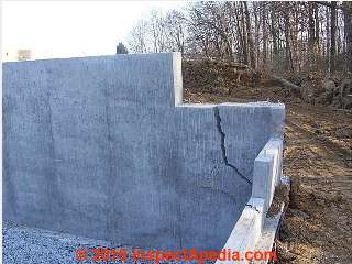 Severe crack in new concrete wall (C) InspectApedia.com